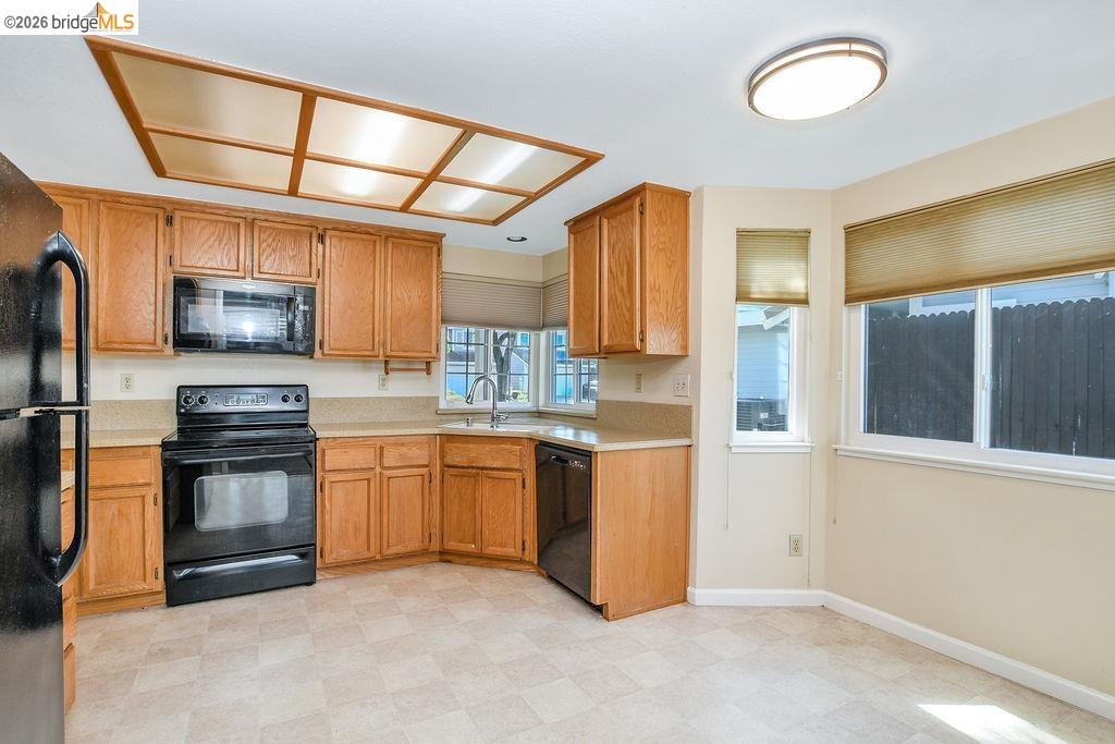 184 Pelican Loop Pittsburg, CA 94565 - Photo 16 of 56 a kitchen with stainless steel appliances granite countertop a stove a sink and a refrigerator