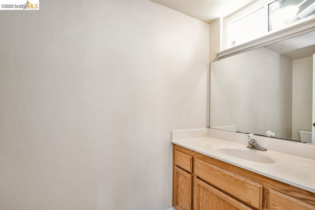 184 Pelican Loop Pittsburg, CA 94565 - Photo 19 of 56 a bathroom with a sink and a mirror