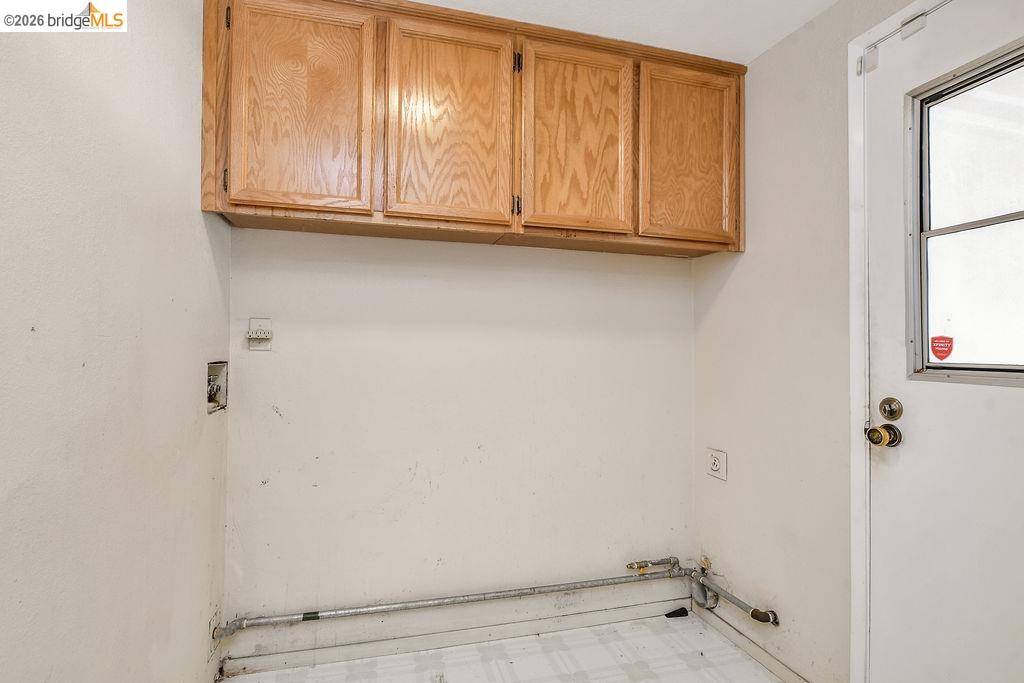184 Pelican Loop Pittsburg, CA 94565 - Photo 20 of 56 Laundry area featuring cabinet space and hookups for a washing machine and dryer