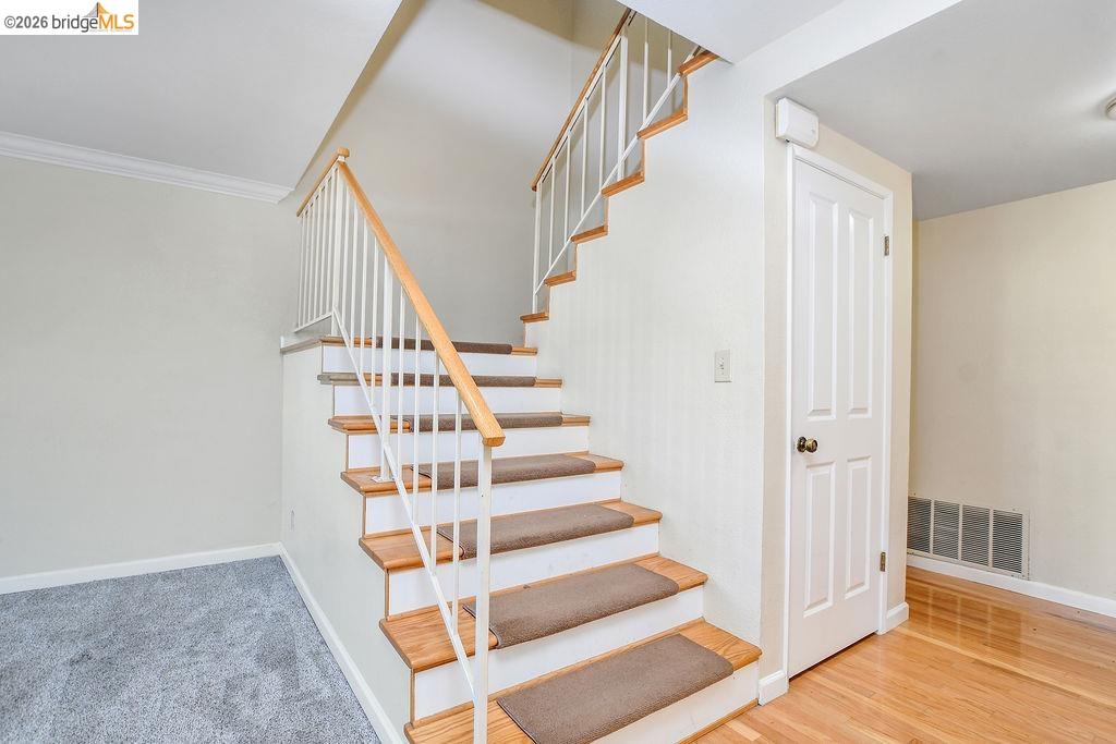 184 Pelican Loop Pittsburg, CA 94565 - Photo 21 of 56 a view of staircase with white walls and windows