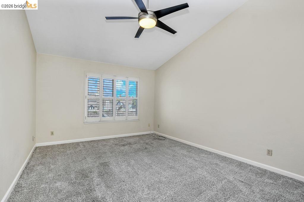 184 Pelican Loop Pittsburg, CA 94565 - Photo 33 of 56 an empty room with a window and a fan