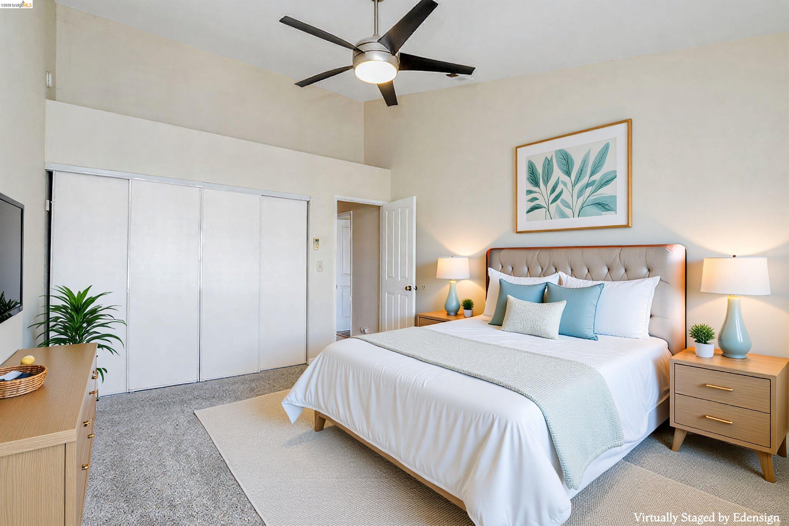 184 Pelican Loop Pittsburg, CA 94565 - Photo 34 of 56 a bedroom with a large bed and a chandelier