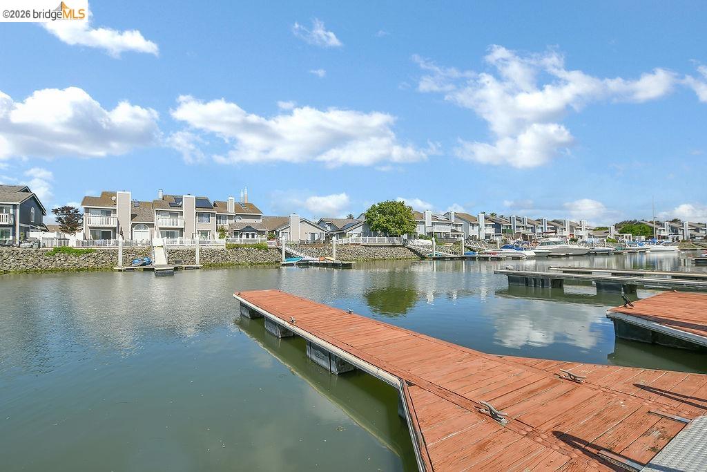 184 Pelican Loop Pittsburg, CA 94565 - Photo 49 of 56 a view of a lake with boats and trees in the background