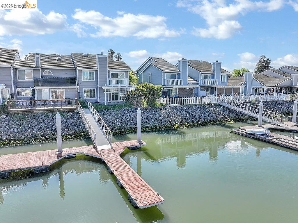 184 Pelican Loop Pittsburg, CA 94565 - Photo 54 of 56 a view of a lake with a building next to a lake