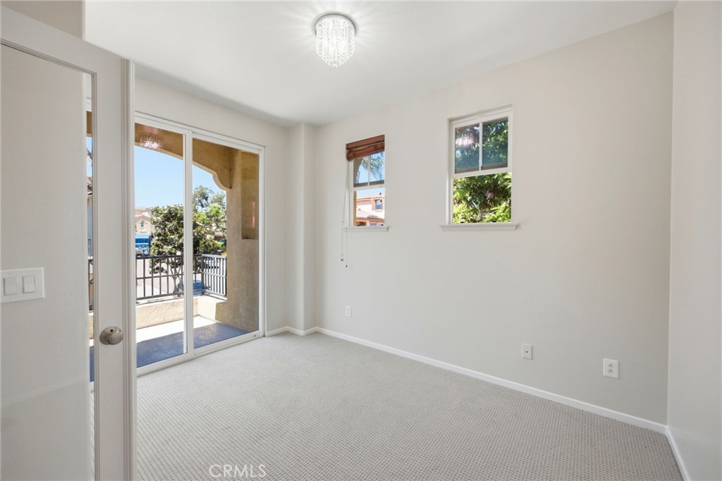 3603 Jetty Carlsbad, CA 92010 - Photo 20 of 43 an empty room with windows and closet