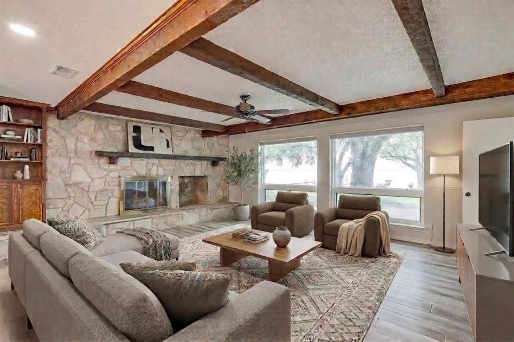 10814 Power Squadron Road Azle, TX 76020 - Photo 9 of 34 a living room with furniture a fireplace and windows