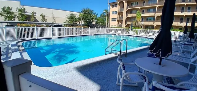 a view of a swimming pool with a lounge chairs