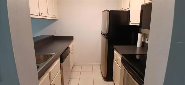 a close view of water heater and cabinet