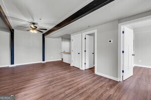 86 South Forest Avenue, Unit A Hartwell, GA 30643 - Photo 11 of 27 a view of empty room with wooden floor and ceiling fan