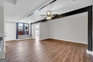 86 South Forest Avenue, Unit A Hartwell, GA 30643 - Photo 14 of 27 a view of an empty room with wooden floor and a window