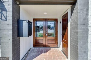 86 South Forest Avenue, Unit A Hartwell, GA 30643 - Photo 2 of 27 a view of a hallway with wooden floor and a bathroom