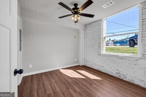 86 South Forest Avenue, Unit A Hartwell, GA 30643 - Photo 22 of 27 wooden floor in an empty room with a window