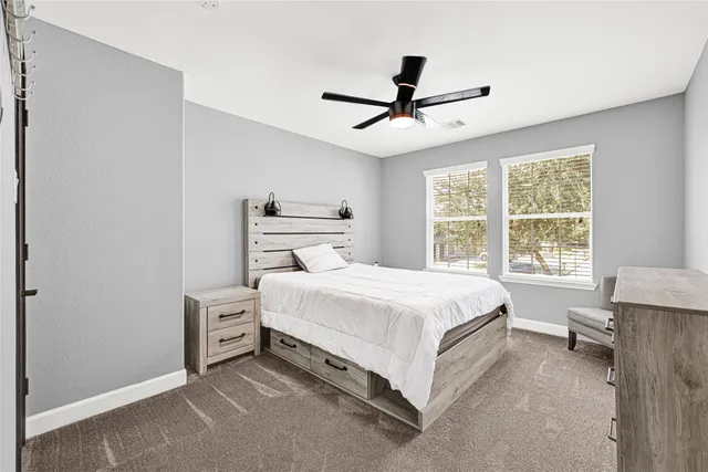 a balcony with furniture and a potted plant