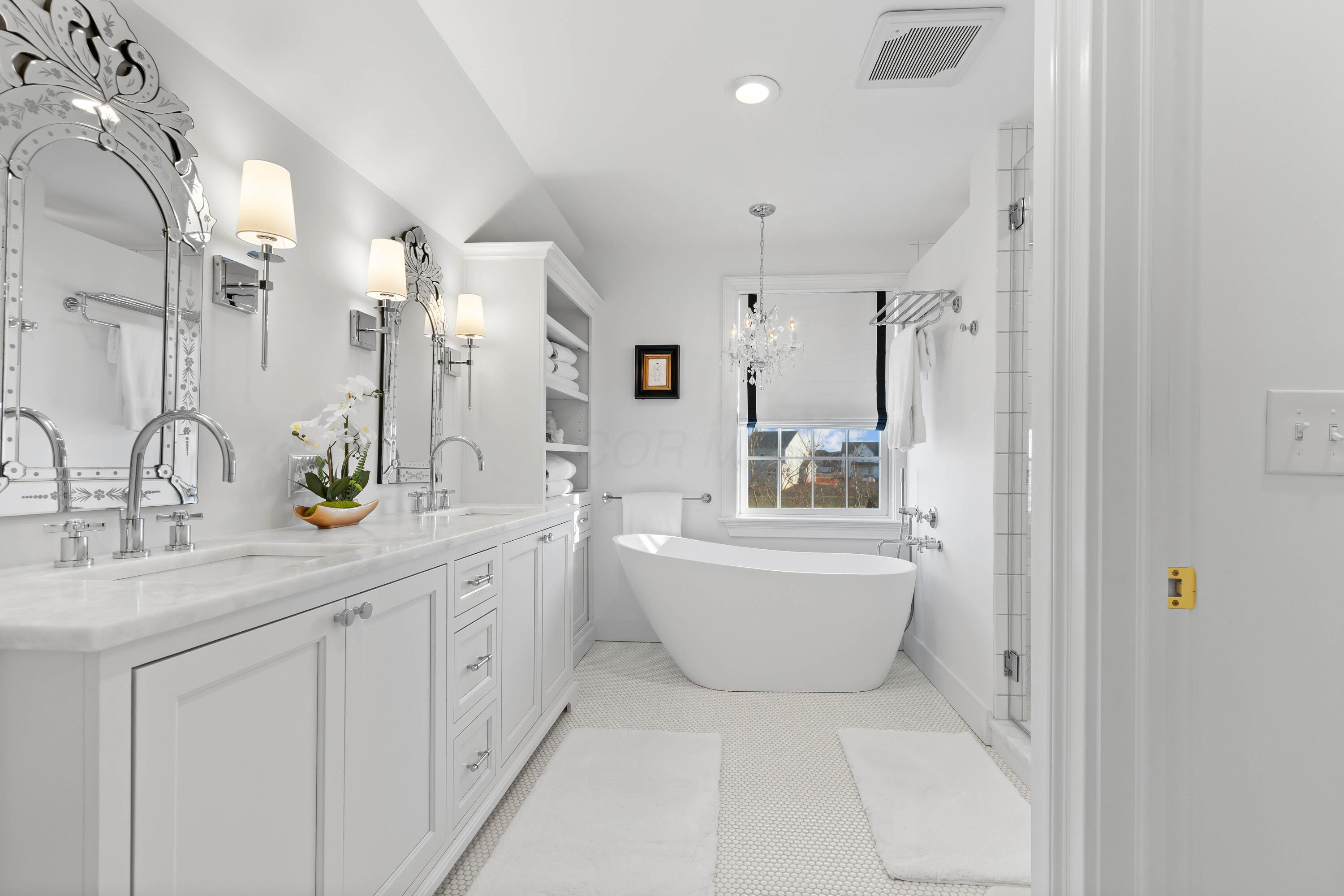1364 Dale Ford Road Delaware, OH 43015 - Photo 51 of 112 • Ceramic tile flooring • White painted walls • Custom built enclosed vanity with double bowl, marble sinktop • Lighted wall sconces • Bubble jetted garden tub • Linen storage • Chandelier • Can lighting • (2) shower stations with rainhead & wands with ceramic tile surround • (1) extra rainhead in center with ceramic tile surround • Pocket door • Mirrors are negotiable