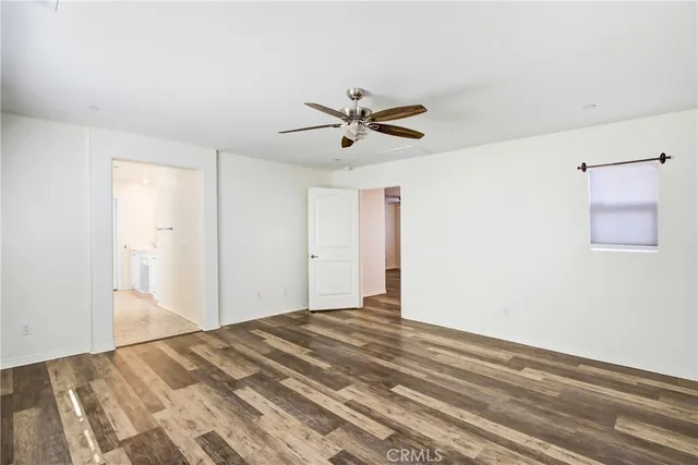 a view of a room with a ceiling fan