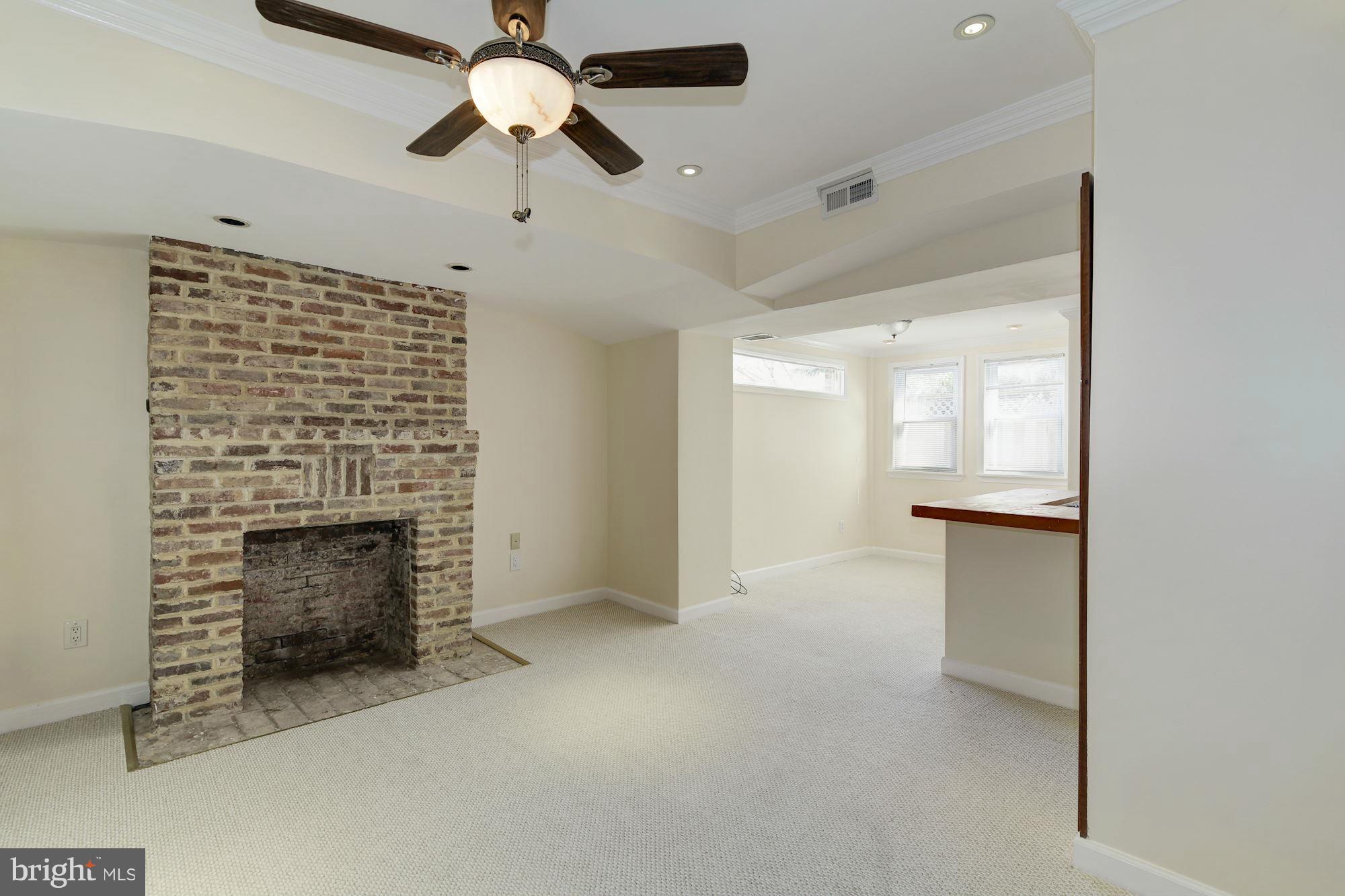 407 M Street Northeast Washington, DC 20002 - Photo 25 of 30 In-law suite living room looking into dining room