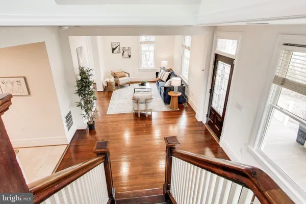 a view of an entryway with wooden floor