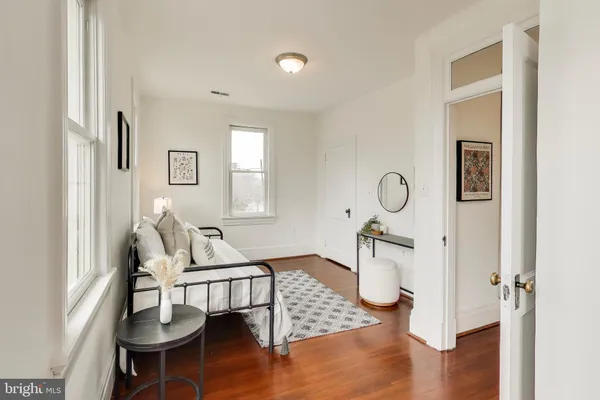 a room with furniture and wooden floor