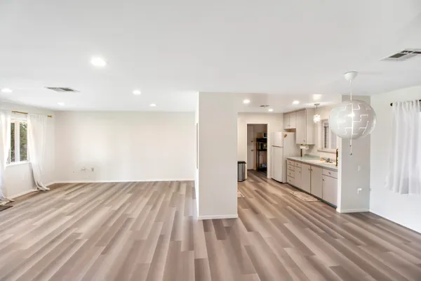 a view of kitchen with wooden floor