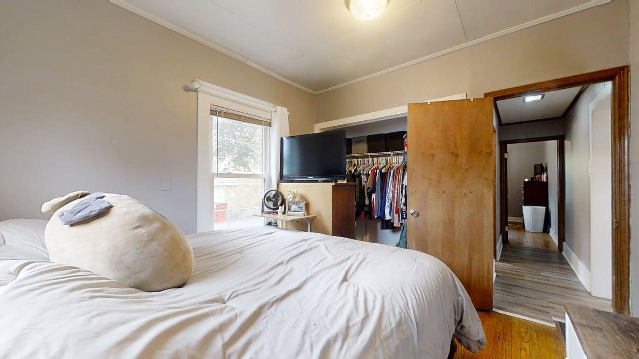 1311 West Hill Street Champaign, IL 61821 - Photo 12 of 25 a bedroom with a bed and a mirror