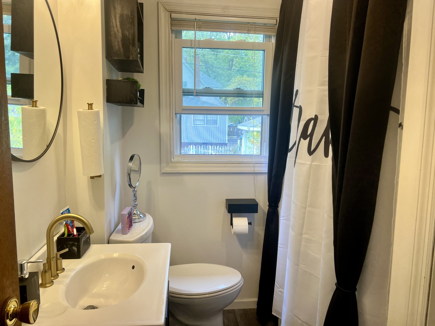 1311 West Hill Street Champaign, IL 61821 - Photo 16 of 25 a bathroom with a sink and a mirror