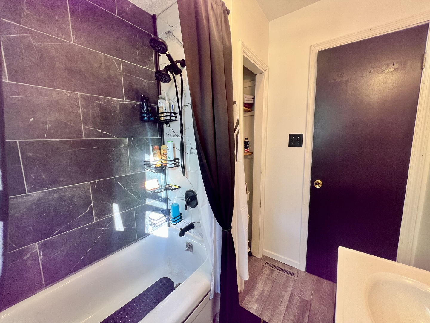 1311 West Hill Street Champaign, IL 61821 - Photo 18 of 25 a bathroom with a bathtub and a shower