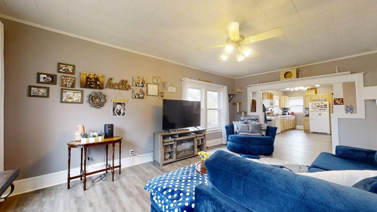1311 West Hill Street Champaign, IL 61821 - Photo 2 of 25 a living room with furniture and a flat screen tv