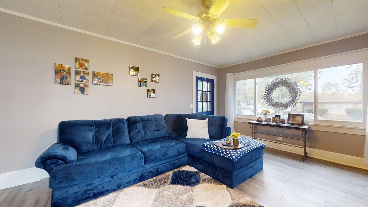 1311 West Hill Street Champaign, IL 61821 - Photo 4 of 25 a living room with furniture and a large window