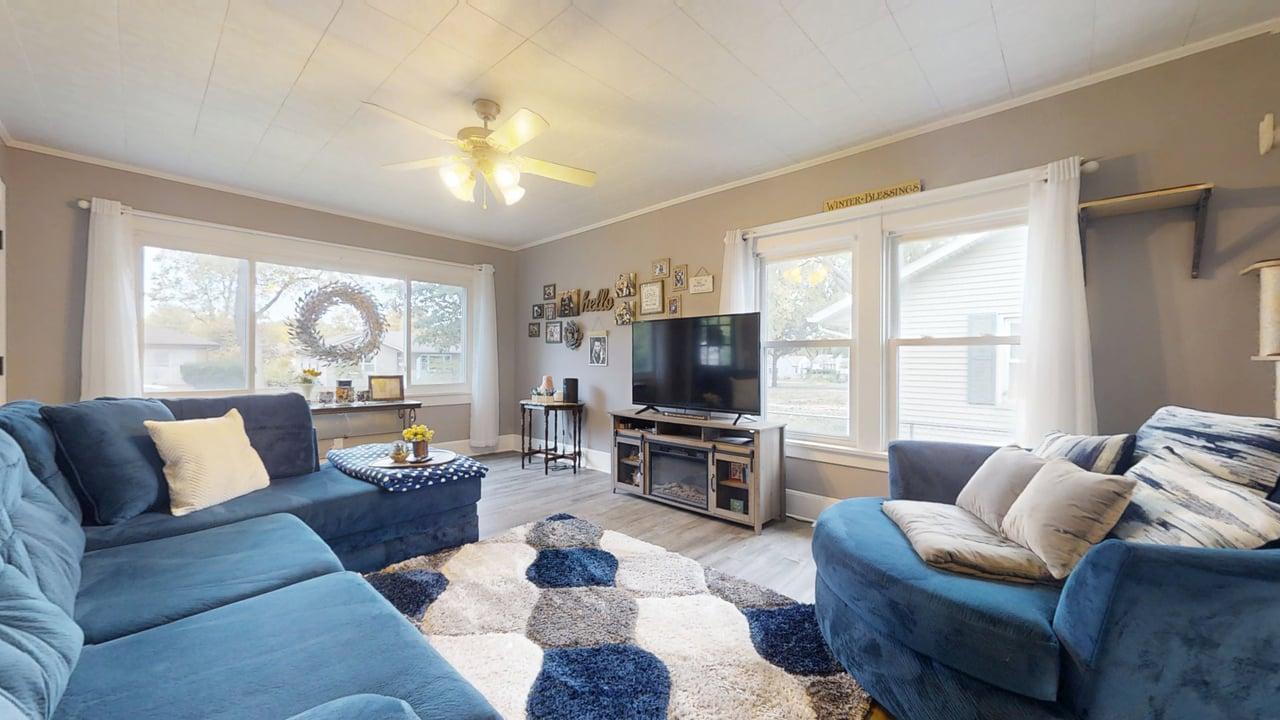 1311 West Hill Street Champaign, IL 61821 - Photo 5 of 25 a living room with furniture and a flat screen tv