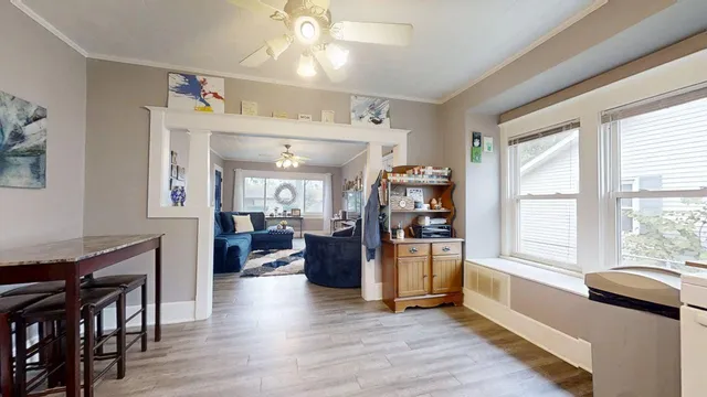 a kitchen with granite countertop white cabinets and white appliances