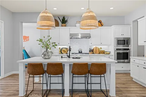 a view of walk in closet with clothes
