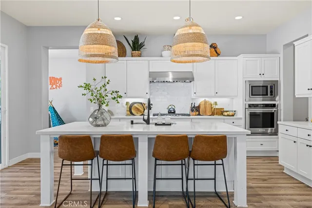 a view of walk in closet with clothes