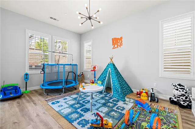 a bedroom with a bed and a desk