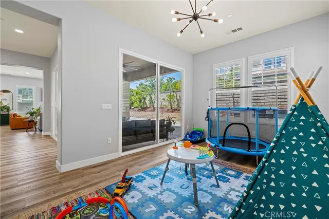 a spacious bedroom with a bed and a shower