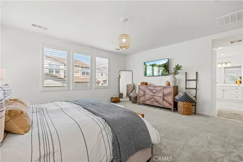 a view of a patio with table and chairs and potted plants