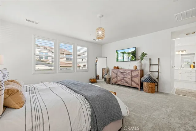 a view of a patio with table and chairs and potted plants