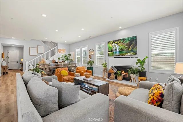 a view of a dining room with furniture wooden floor and chandelier