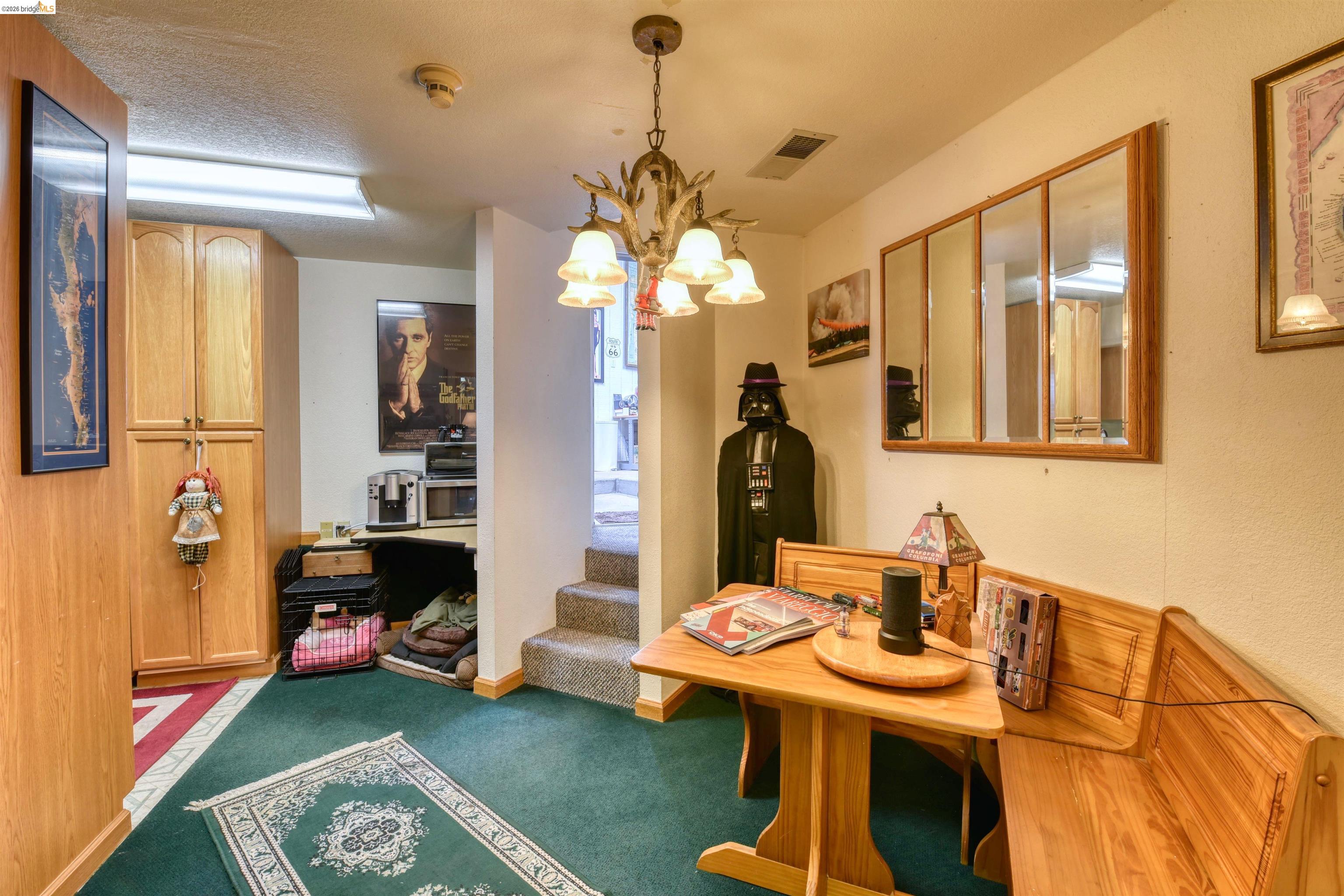 20950 Ferretti Road Groveland, CA 95321 - Photo 19 of 27 a view of a dining room with furniture and a chandelier