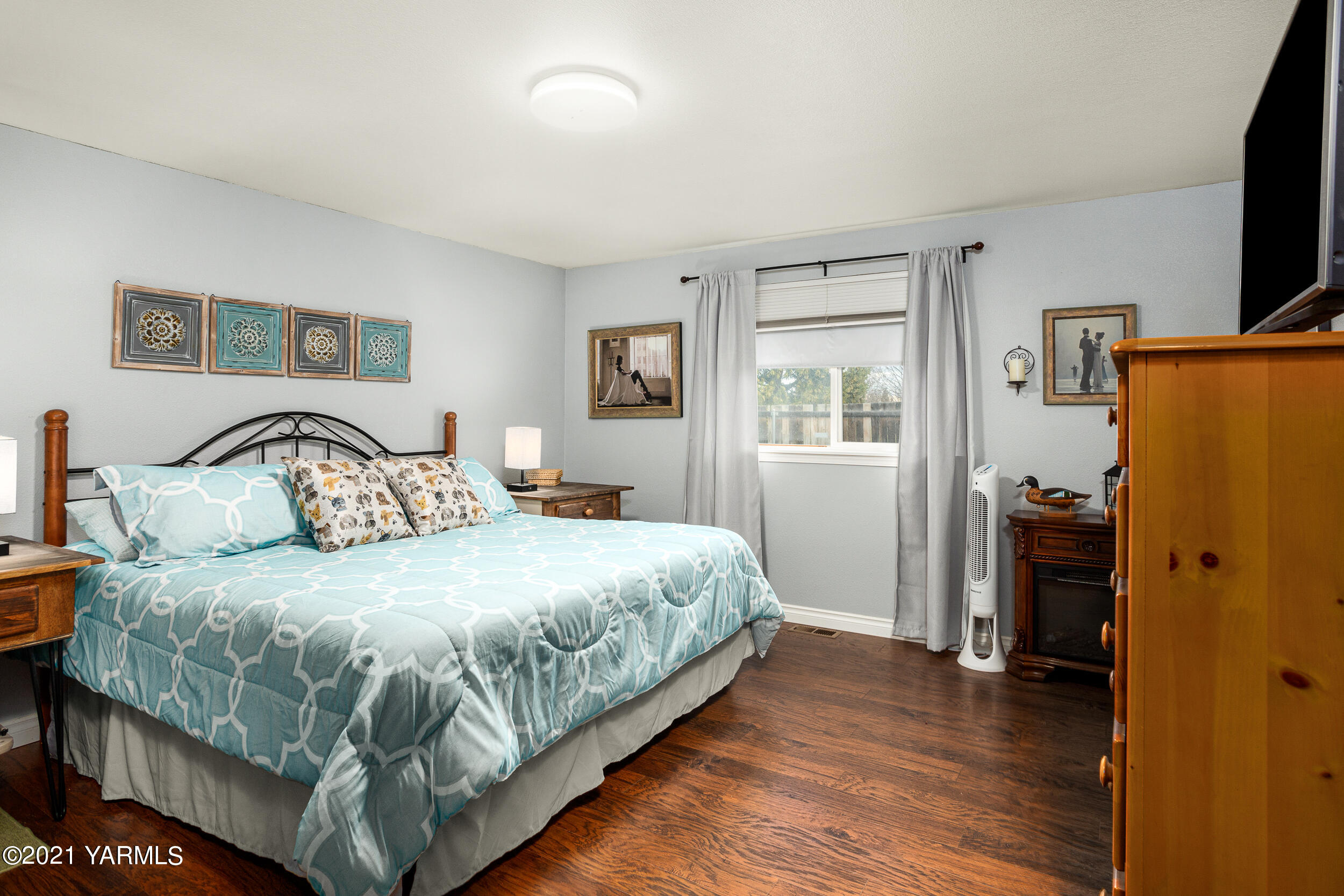 1517 South 32nd Avenue Yakima, WA 98902 - Photo 13 of 21 a bedroom with a bed and a flat screen tv