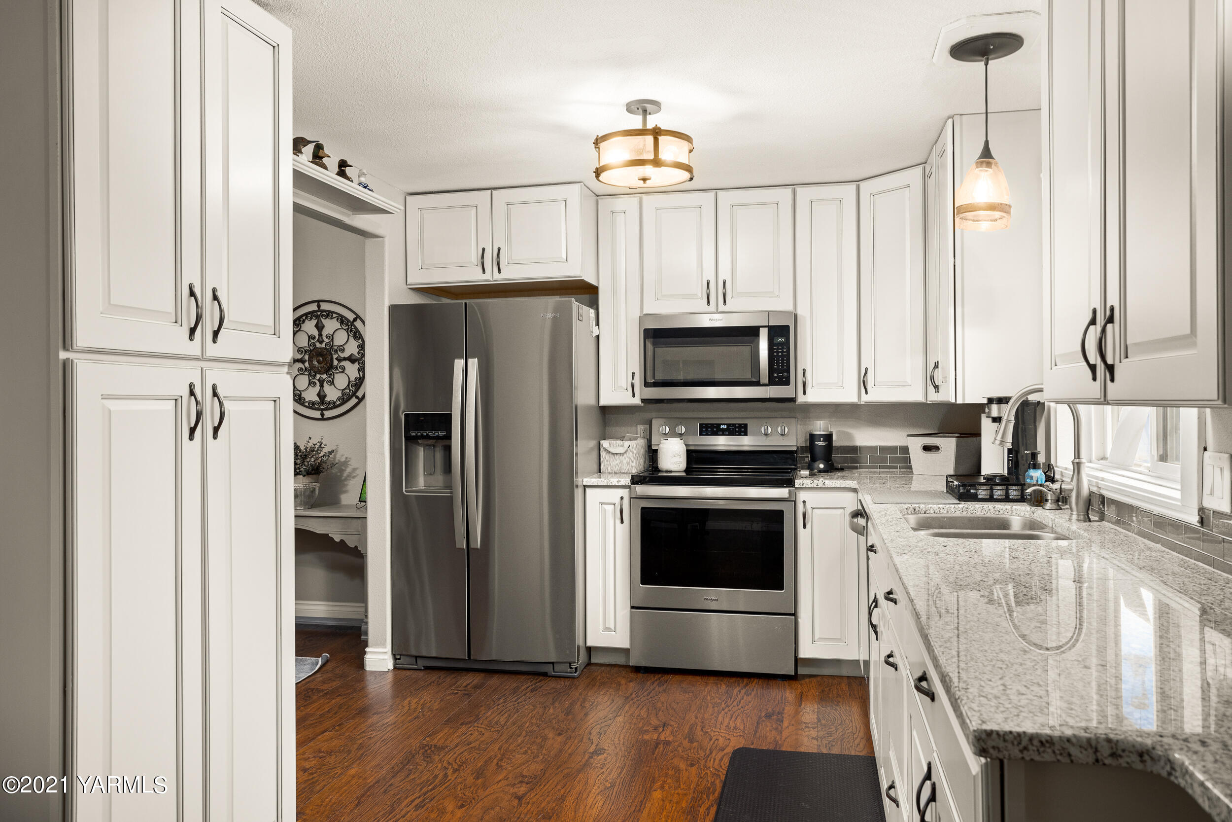1517 South 32nd Avenue Yakima, WA 98902 - Photo 9 of 21 a kitchen with stainless steel appliances a refrigerator stove and microwave