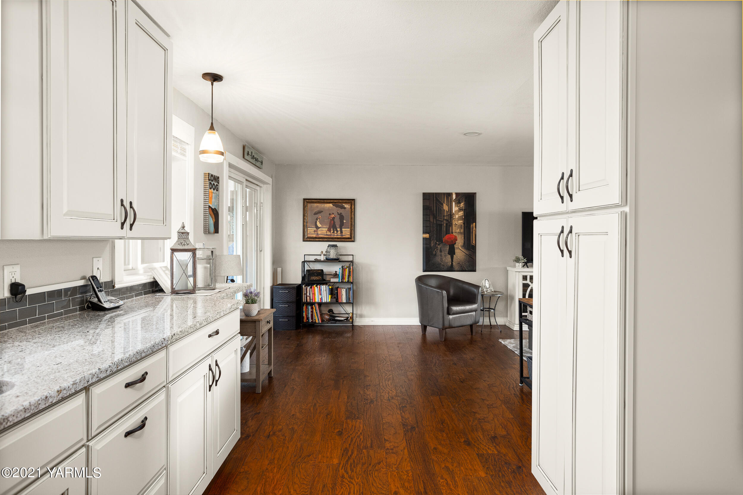 1517 South 32nd Avenue Yakima, WA 98902 - Photo 10 of 21 a open kitchen with sink cabinets and wooden floor