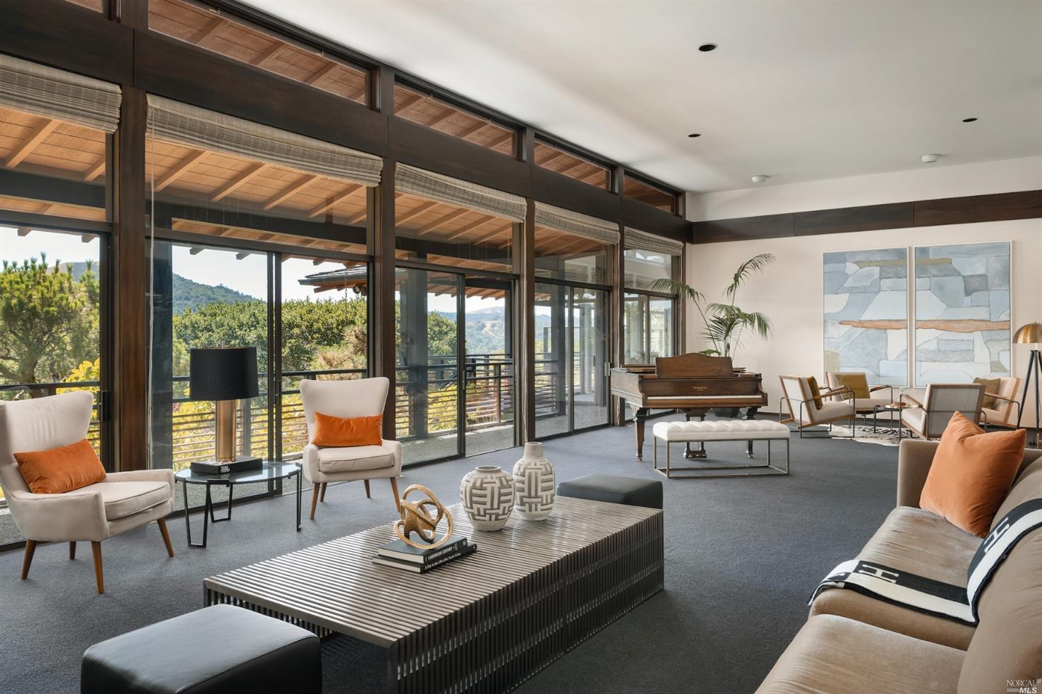 21 Canyon Road Ross, CA 94957 - Photo 11 of 41 a living room with furniture and floor to ceiling windows