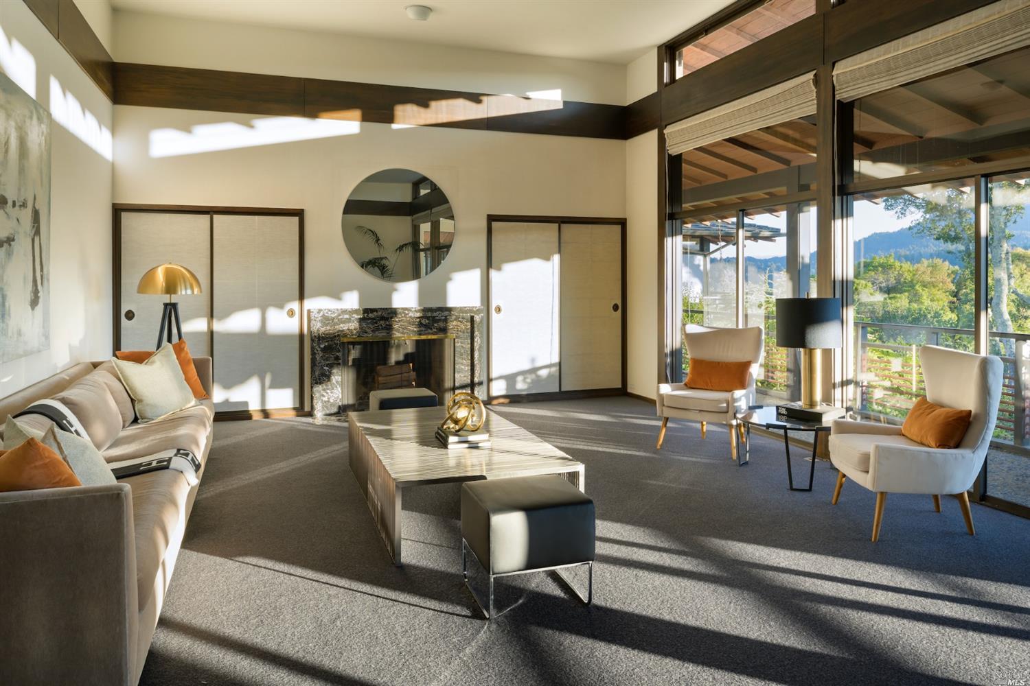 21 Canyon Road Ross, CA 94957 - Photo 12 of 41 a room with lots of white furniture and a large window