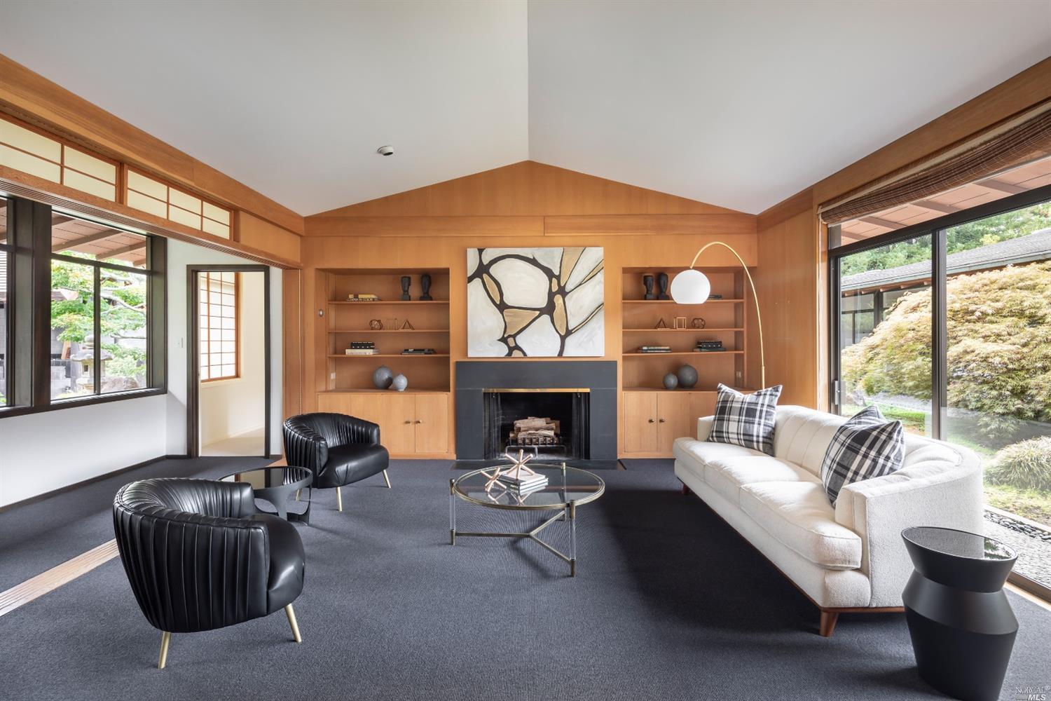 21 Canyon Road Ross, CA 94957 - Photo 19 of 41 a living room with furniture a fireplace and a large window
