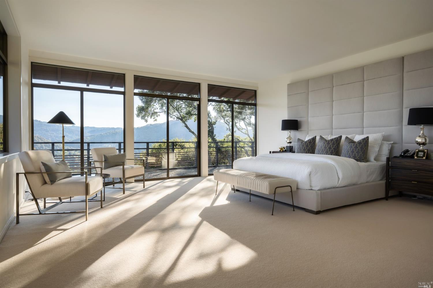 21 Canyon Road Ross, CA 94957 - Photo 21 of 41 a spacious bedroom with a bed and large glass window