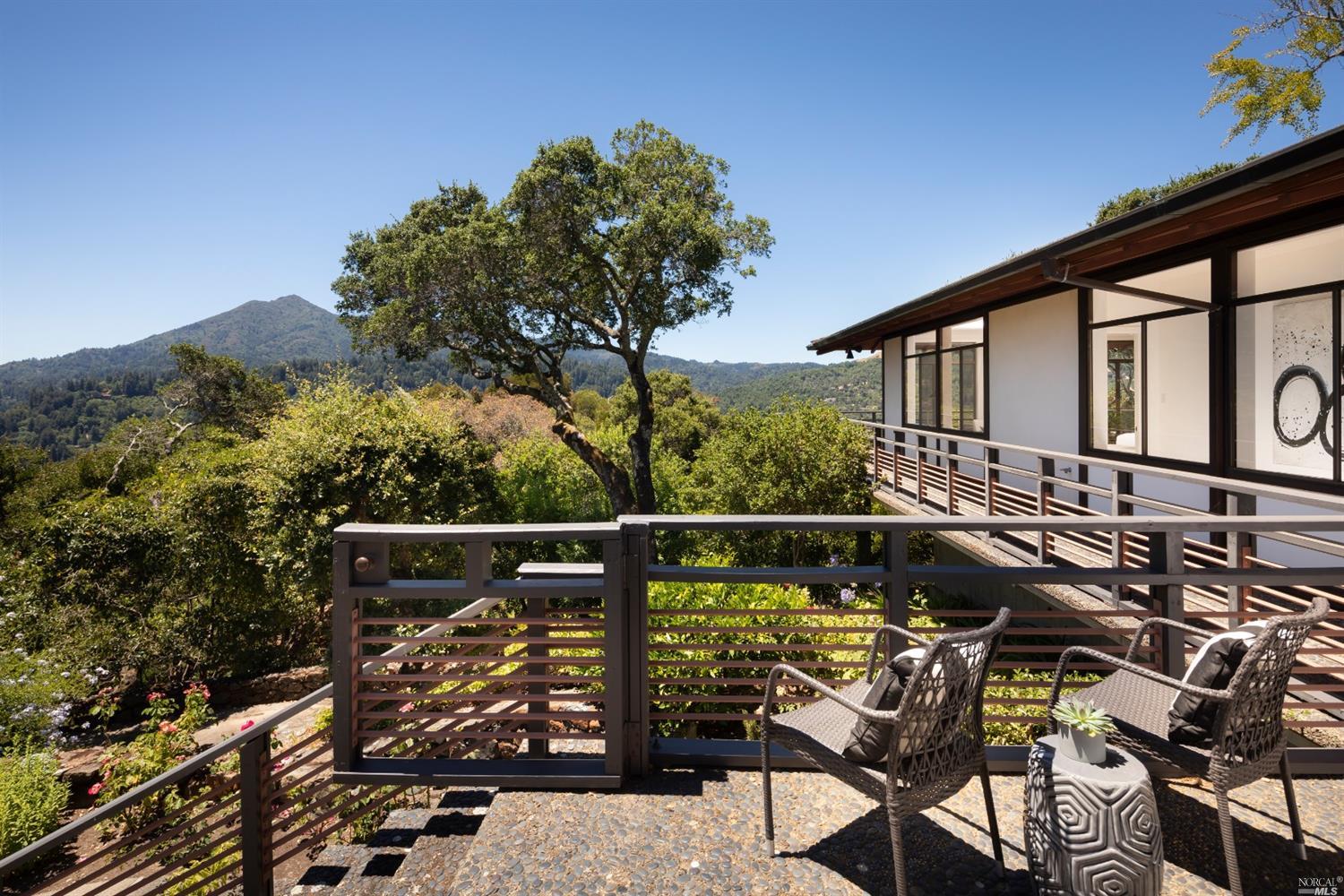 21 Canyon Road Ross, CA 94957 - Photo 33 of 41 a roof deck with table and chairs and potted plants