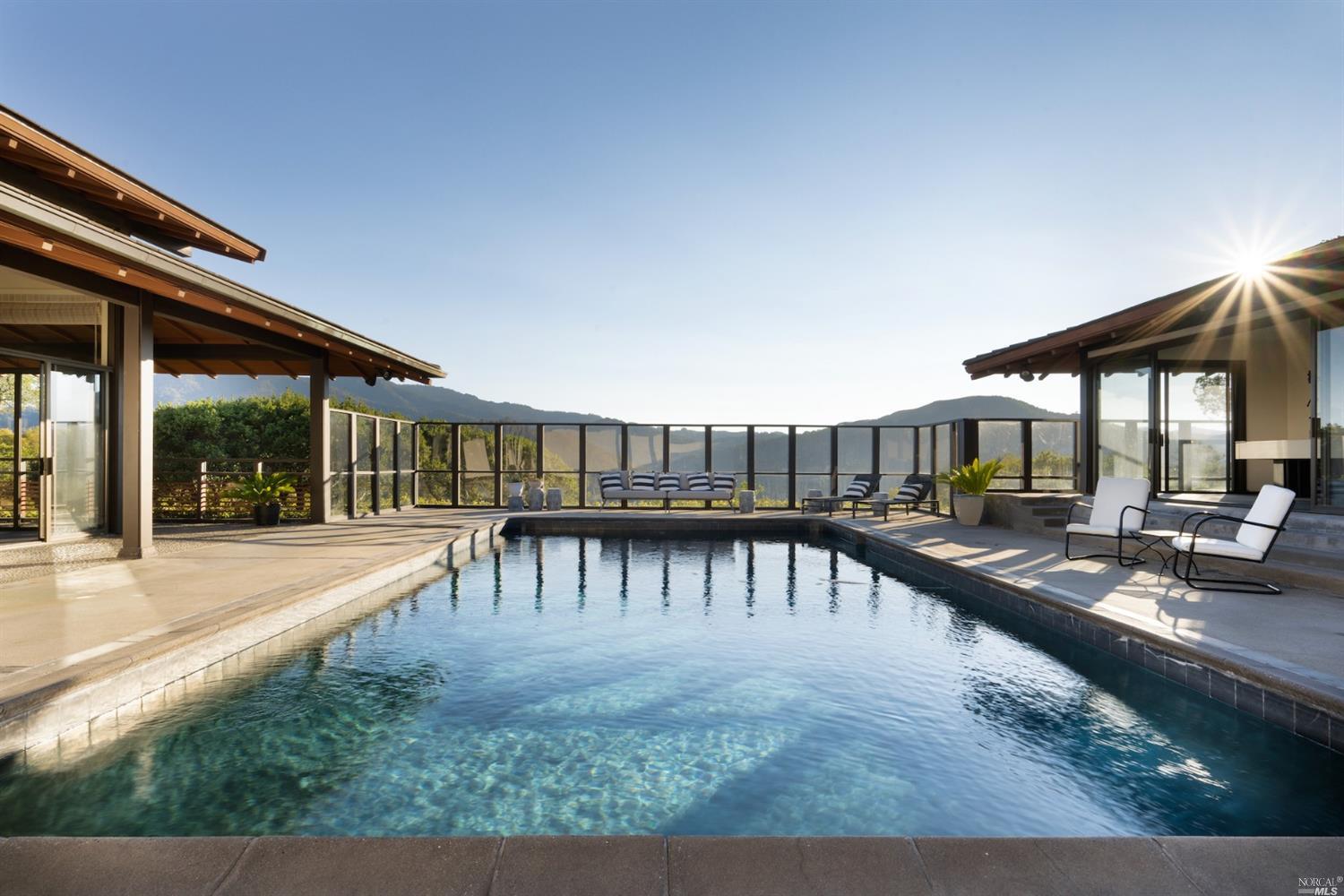 21 Canyon Road Ross, CA 94957 - Photo 37 of 41 a view of a swimming pool with a patio