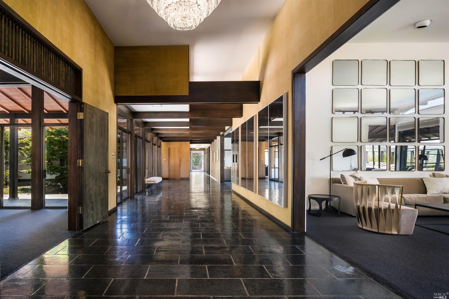 21 Canyon Road Ross, CA 94957 - Photo 5 of 41 a hallway with wooden floor and furniture