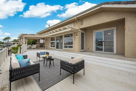 a view of roof deck with patio