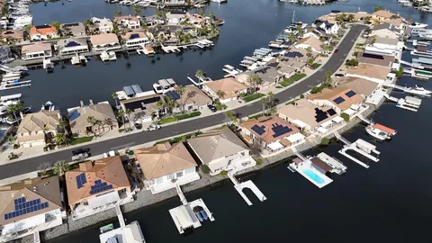 an aerial view of a dining room with wooden floor
